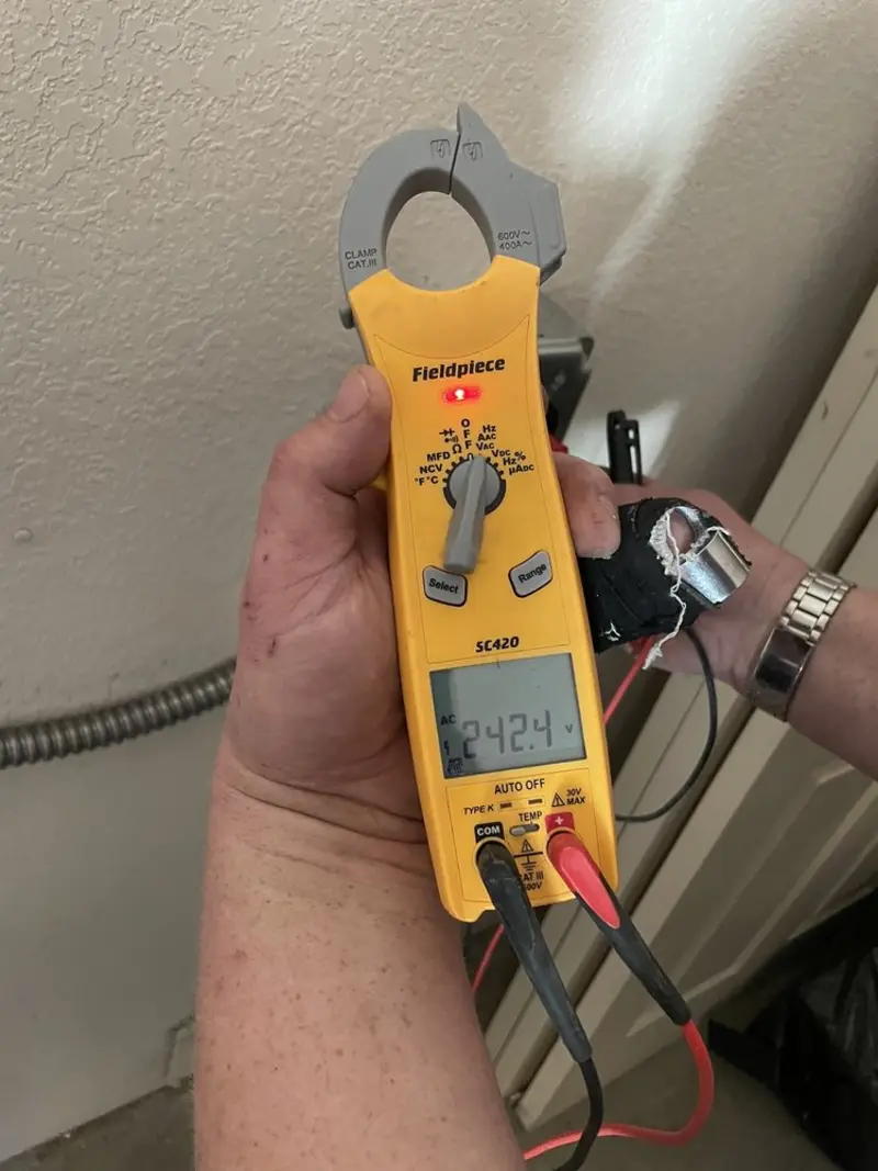 Voltage testing with clamp meter during Electrical Installation Services in North Valley